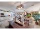 Bright open-concept living room, with a fireplace and large windows at 3134 N 145Th Ave, Goodyear, AZ 85395