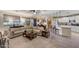 Open concept living room seamlessly connects to the kitchen and dining area at 3134 N 145Th Ave, Goodyear, AZ 85395