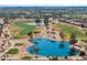Scenic aerial view of a golf course with ponds and lush greenery in a residential community at 3362 N 159Th Ave, Goodyear, AZ 85395