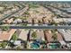 Aerial view of a residential neighborhood featuring a golf course and mature landscaping at 3362 N 159Th Ave, Goodyear, AZ 85395