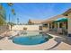 Beautiful backyard featuring a refreshing pool, spa, and a shaded patio with plenty of seating at 3362 N 159Th Ave, Goodyear, AZ 85395