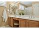 Bathroom featuring double sinks, a vanity area, and a well-lit mirror at 3362 N 159Th Ave, Goodyear, AZ 85395