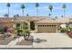 Charming single-story home featuring a tile roof, desert landscaping, and a two-car garage at 3362 N 159Th Ave, Goodyear, AZ 85395