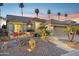 Charming one-story home with desert landscaping, a two-car garage, and warm exterior lighting at 3362 N 159Th Ave, Goodyear, AZ 85395