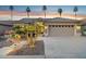 Beautiful one-story home featuring a two-car garage, desert landscaping, and well-lit walkway at 3362 N 159Th Ave, Goodyear, AZ 85395