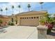 Attractive home featuring a tile roof, well-kept desert landscaping, and a spacious two-car garage at 3362 N 159Th Ave, Goodyear, AZ 85395