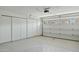 Clean and spacious garage with lots of storage, white painted floors and an automatic door at 3362 N 159Th Ave, Goodyear, AZ 85395