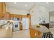 Bright kitchen with tiled floors, wooden cabinets, island, and modern appliances at 3362 N 159Th Ave, Goodyear, AZ 85395