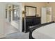 Bedroom with a black dresser, mirror, carpet, and a sliding glass door to the outdoor space at 3362 N 159Th Ave, Goodyear, AZ 85395
