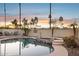Backyard pool and spa area, surrounded by lush landscaping and a private wall at 3362 N 159Th Ave, Goodyear, AZ 85395