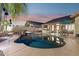 Backyard pool with a covered patio and outdoor bar area, perfect for entertaining guests at 3362 N 159Th Ave, Goodyear, AZ 85395