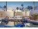 Inviting backyard spa featuring rock accents and privacy landscaping, perfect for relaxation at 3362 N 159Th Ave, Goodyear, AZ 85395