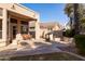 Relaxing covered back patio with table, chairs and firepit at 3631 S Greythorne S Way, Chandler, AZ 85248