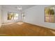 Bedroom with three windows providing natural light, carpeted flooring, and a ceiling fan at 3631 S Greythorne S Way, Chandler, AZ 85248