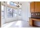 Light-filled breakfast nook with large windows and a charming chandelier, creating a warm and inviting dining space at 3631 S Greythorne S Way, Chandler, AZ 85248