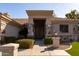 Beautiful entrance with stone accents and well-manicured desert landscaping at 3631 S Greythorne S Way, Chandler, AZ 85248
