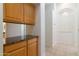 Hallway with cabinets and a granite countertop near an arched entryway at 3631 S Greythorne S Way, Chandler, AZ 85248