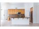 Bright and inviting kitchen with an island, stainless appliances, and abundant cabinetry at 3631 S Greythorne S Way, Chandler, AZ 85248