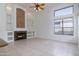 Inviting living room with a cozy fireplace and stylish built-in shelving, perfect for relaxation and entertaining at 3631 S Greythorne S Way, Chandler, AZ 85248