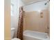 Shower area featuring cream-colored walls, a shower curtain, and a toilet nearby at 3631 S Greythorne S Way, Chandler, AZ 85248