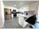 Updated kitchen with stainless steel appliances and sleek breakfast bar at 3650 W Cortez St, Phoenix, AZ 85029