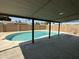 Covered patio area offering serene views of the sparkling pool and backyard oasis, an ideal space for entertaining at 3650 W Cortez St, Phoenix, AZ 85029