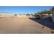 Large backyard featuring small sheds and desert vegetation at 38234 N 15Th Ave, Phoenix, AZ 85086