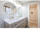 Bathroom featuring double sinks, quartz countertops, and a tiled walk-in shower at 38234 N 15Th Ave, Phoenix, AZ 85086