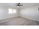 Bedroom with a ceiling fan and tiled floors, illuminated by natural light through a window at 38234 N 15Th Ave, Phoenix, AZ 85086