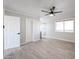 Bedroom with tiled floors, white trim, and a window with wooden blinds at 38234 N 15Th Ave, Phoenix, AZ 85086