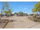 Expansive circular driveway leads to a single-level home with mature desert landscaping at 38234 N 15Th Ave, Phoenix, AZ 85086