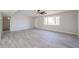 Open living room with tile floors, a ceiling fan, and natural light from a large window at 38234 N 15Th Ave, Phoenix, AZ 85086