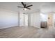 Main bedroom with a ceiling fan, tiled floors, and an ensuite bathroom with double sinks at 38234 N 15Th Ave, Phoenix, AZ 85086