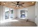 Bright sunroom with wood ceiling, tile floors, lots of natural light, and seamless transition to the kitchen and backyard at 38234 N 15Th Ave, Phoenix, AZ 85086