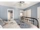 Bedroom featuring a bed, an adjacent bathroom and a closet with sliding doors at 4122 E Jojoba Rd, Phoenix, AZ 85044