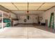 Garage with built-in storage cabinets and ample space for parking and other activities at 4122 E Jojoba Rd, Phoenix, AZ 85044