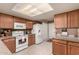 Bright kitchen with appliances and ample counter space, perfect for cooking at 4122 E Jojoba Rd, Phoenix, AZ 85044
