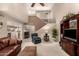 Spacious living room featuring soaring ceilings, a ceiling fan, and stairs to the upper level at 4122 E Jojoba Rd, Phoenix, AZ 85044