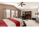 Spacious main bedroom with a vaulted ceiling and a dedicated office space at 4122 E Jojoba Rd, Phoenix, AZ 85044