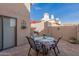 Private patio with a table and seating, perfect for outdoor dining and relaxation at 4122 E Jojoba Rd, Phoenix, AZ 85044