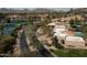Community aerial view featuring tennis courts, pool and lush landscaping with mountain views at 4442 E Camelback Rd # 161, Phoenix, AZ 85018