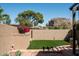 Scenic backyard with lush greenery, a privacy wall, and an inviting outdoor space at 4442 E Camelback Rd # 161, Phoenix, AZ 85018