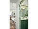 Bathroom with green tiling, archway, and gold hardware at 4442 E Camelback Rd # 161, Phoenix, AZ 85018