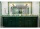 Double sink bathroom vanity featuring vintage green tiles at 4442 E Camelback Rd # 161, Phoenix, AZ 85018