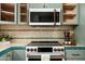 Modern kitchen with stainless steel appliances, stylish tile backsplash, and sleek countertops at 4442 E Camelback Rd # 161, Phoenix, AZ 85018