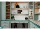 Close-up of a well-organized kitchen area featuring decor and two black stools at 4442 E Camelback Rd # 161, Phoenix, AZ 85018