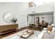 Spacious living room with a large window, modern furniture, and sight lines to the dining room at 4442 E Camelback Rd # 161, Phoenix, AZ 85018