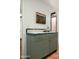 Charming wet bar featuring turquoise tile and muted green cabinets at 4442 E Camelback Rd # 161, Phoenix, AZ 85018