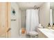 Clean bathroom with a shower-tub combo and a toilet at 4620 N 68Th St # 117, Scottsdale, AZ 85251