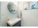 Modern powder room featuring a vessel sink and decorative succulent prints at 4620 N 68Th St # 117, Scottsdale, AZ 85251